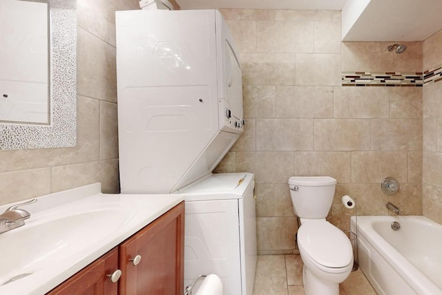 full bathroom featuring shower / tub combination, tile patterned flooring, tile walls, vanity, and toilet