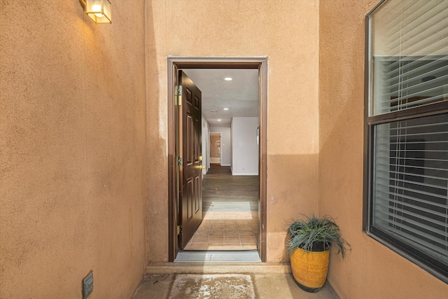 property entrance featuring stucco siding