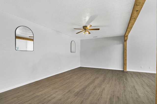 unfurnished room with a textured ceiling, baseboards, a ceiling fan, and wood finished floors