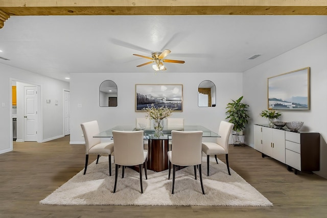 dining area featuring visible vents, ceiling fan, baseboards, and wood finished floors