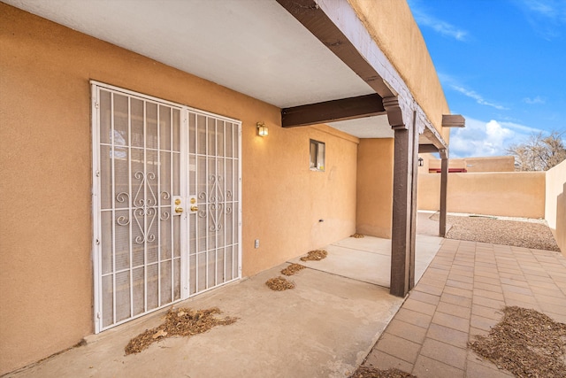 view of patio featuring fence