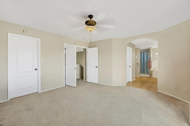 unfurnished bedroom with light carpet