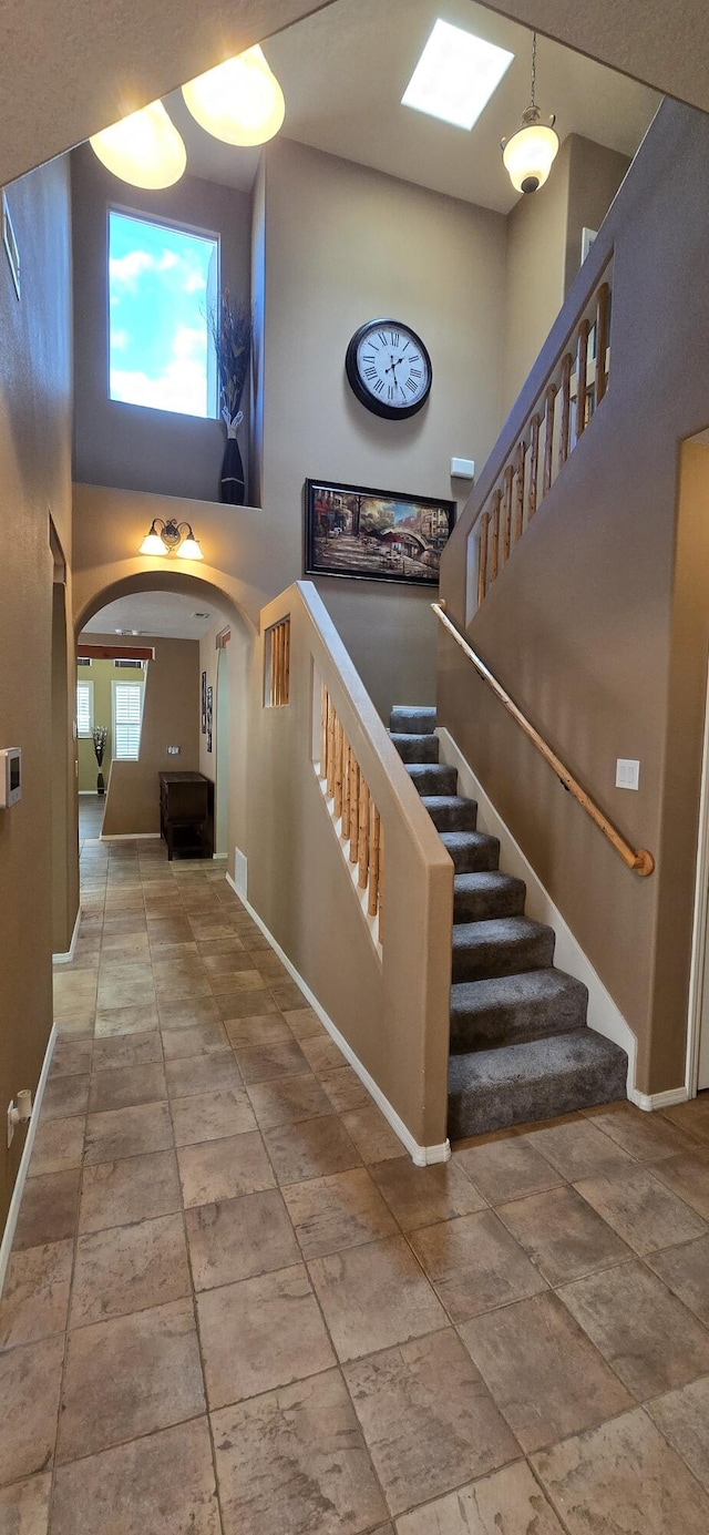 stairway with a high ceiling