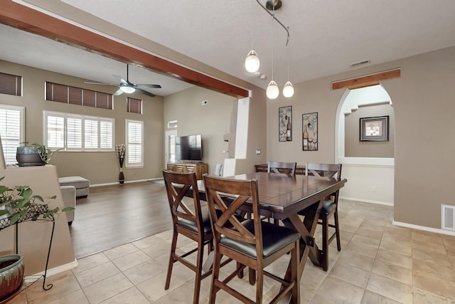 dining space featuring light tile patterned floors and ceiling fan