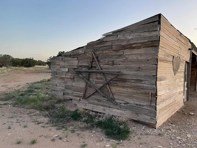 view of outdoor structure at dusk