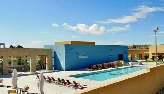 view of pool featuring a patio