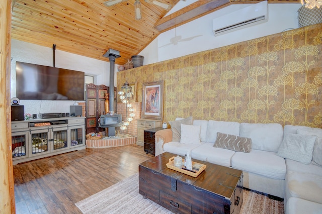 living room with hardwood / wood-style flooring, ceiling fan, wooden ceiling, an AC wall unit, and a wood stove