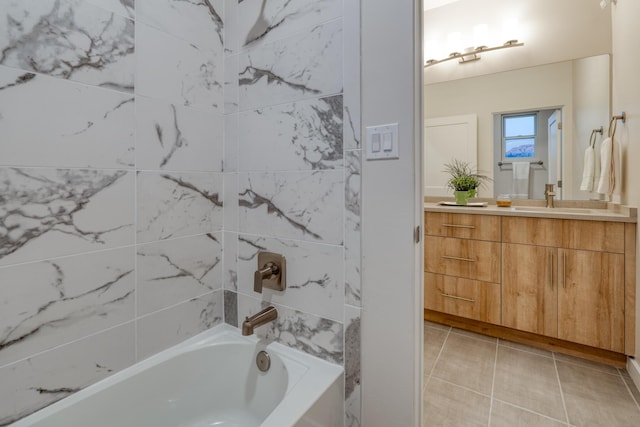 bathroom featuring vanity, tiled shower / bath combo, and tile patterned floors