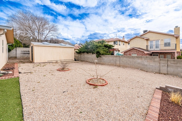 view of yard with a fenced backyard and a residential view