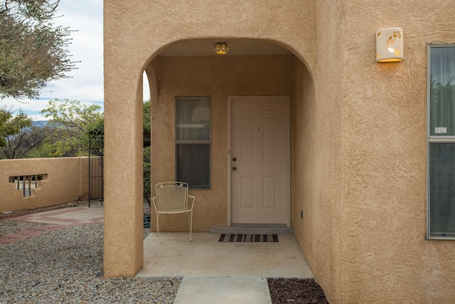 doorway to property featuring a patio area