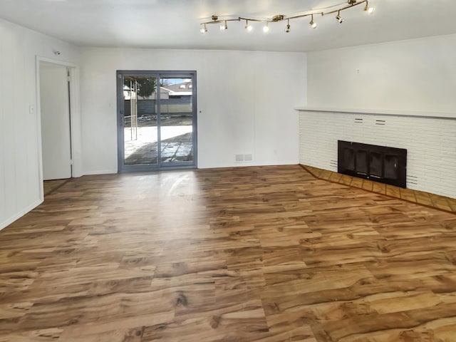 unfurnished room with wood-type flooring