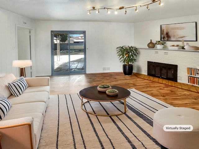 living room featuring hardwood / wood-style floors and a fireplace