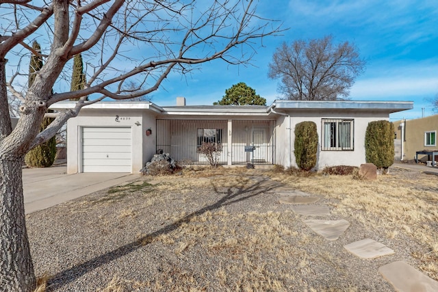 ranch-style home featuring a garage