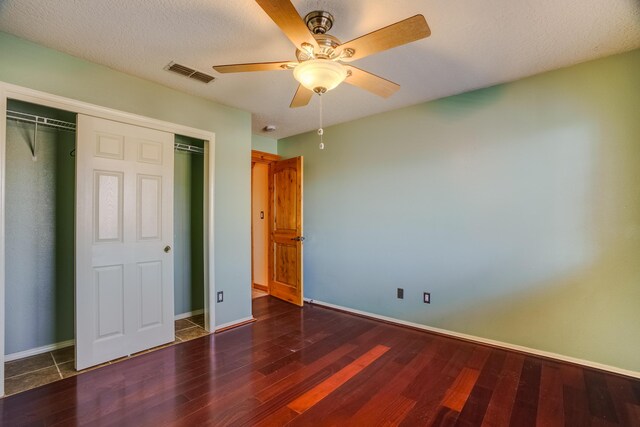 11001 Alta Dr NW, Albuquerque, NM 87114 - unfurnished bedroom with baseboards, visible vents, a closet, and wood finished floors