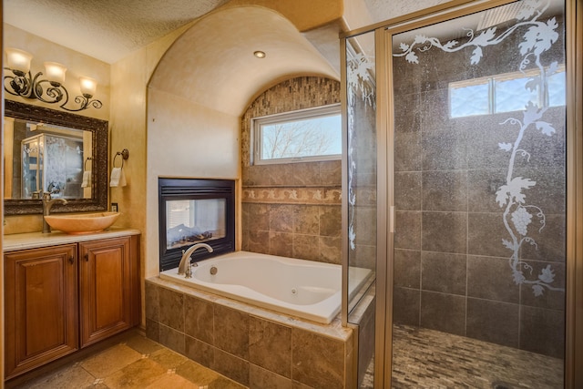 11001 Alta Dr NW, Albuquerque, NM 87114 - bathroom with a shower stall, a textured ceiling, vanity, and a garden tub