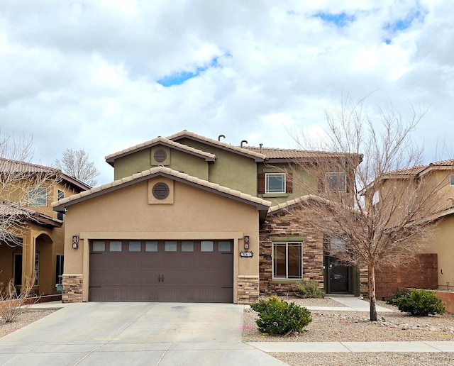 view of front facade featuring stone siding, stucco siding, a tiled roof, and concrete driveway