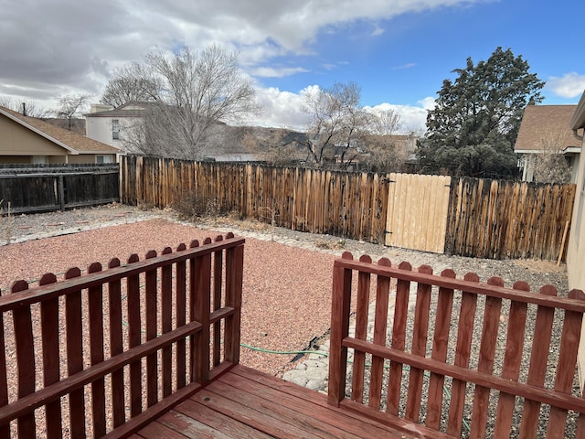 deck with a fenced backyard