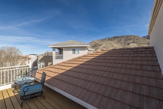 wooden terrace with a mountain view