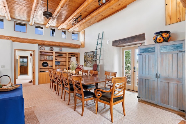 506 Dinkle Rd, Edgewood, NM 87015 - dining space featuring wood ceiling, beamed ceiling, and a towering ceiling