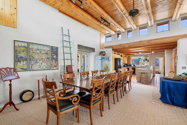 506 Dinkle Rd, Edgewood, NM 87015 - dining room with light carpet, beamed ceiling, wooden ceiling, and track lighting