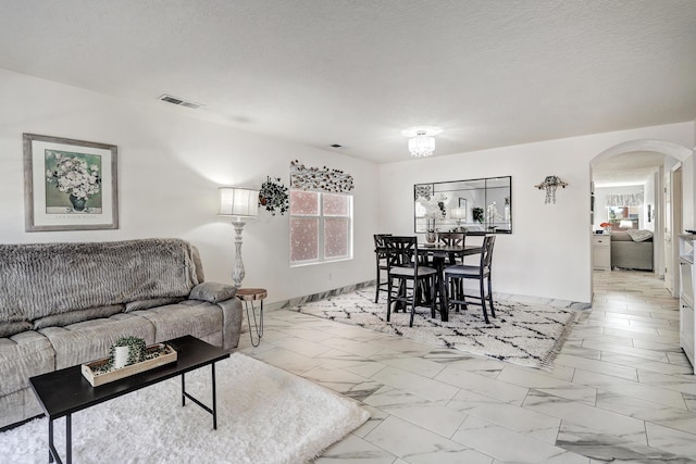 living room featuring a textured ceiling