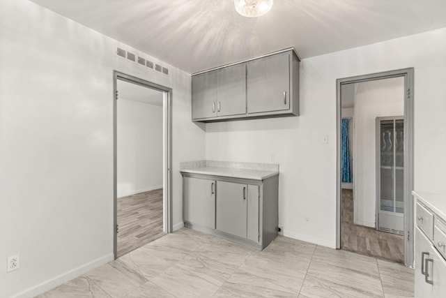 kitchen featuring gray cabinetry