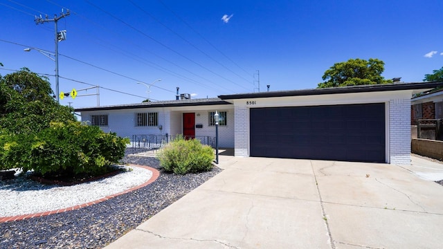 ranch-style home with a garage