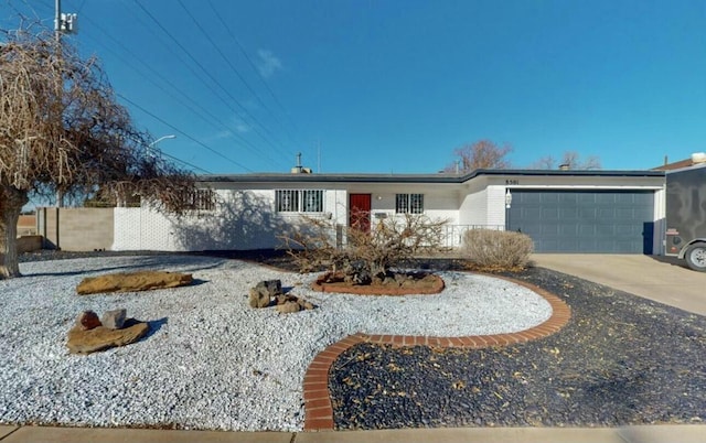 ranch-style house featuring a garage