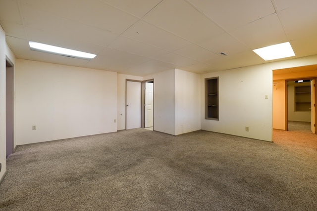 unfurnished room featuring carpet