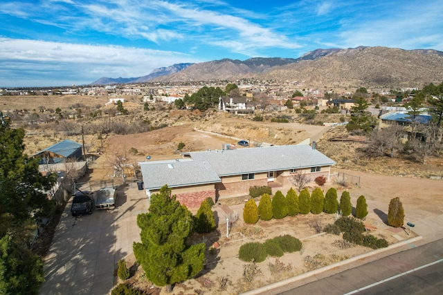 birds eye view of property with a mountain view