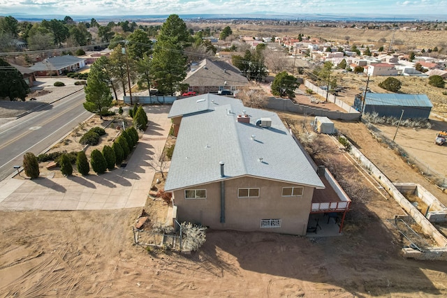 birds eye view of property with a residential view