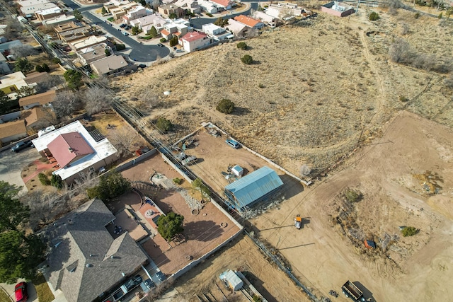 birds eye view of property with a residential view