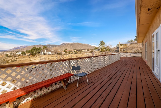 wooden deck featuring a mountain view