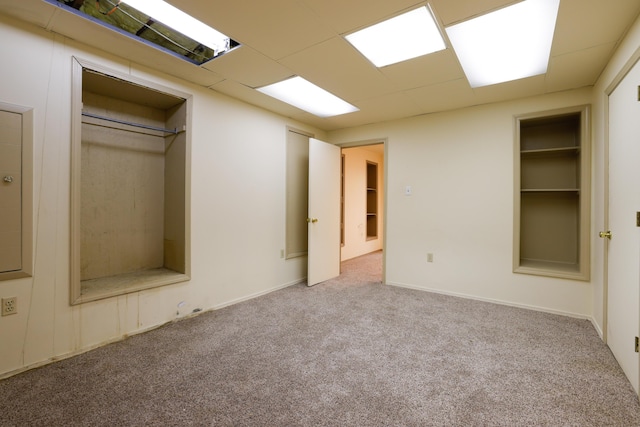 interior space featuring a drop ceiling