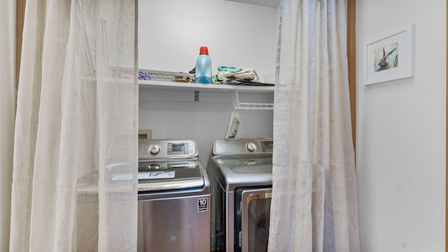 washroom with laundry area and separate washer and dryer