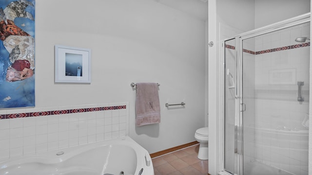 bathroom with a stall shower, toilet, a tub with jets, and tile patterned floors