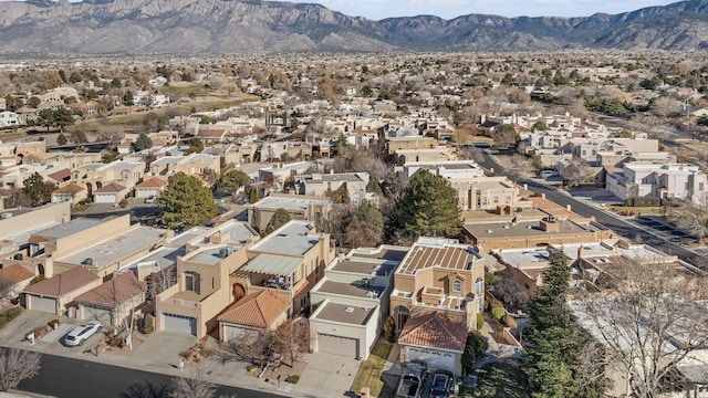 drone / aerial view featuring a mountain view and a residential view