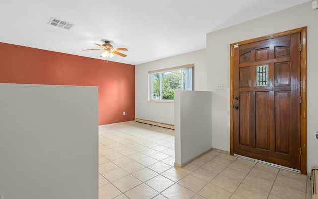 tiled foyer entrance featuring ceiling fan and baseboard heating