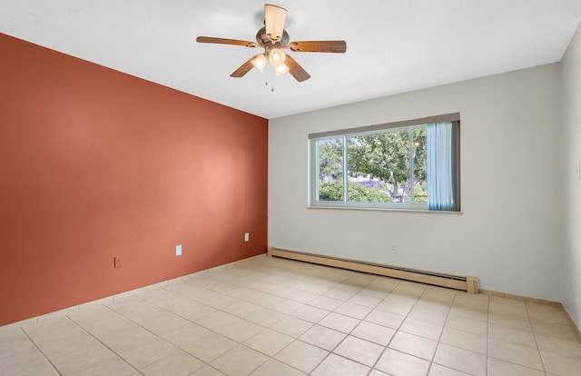 tiled spare room with ceiling fan and a baseboard heating unit