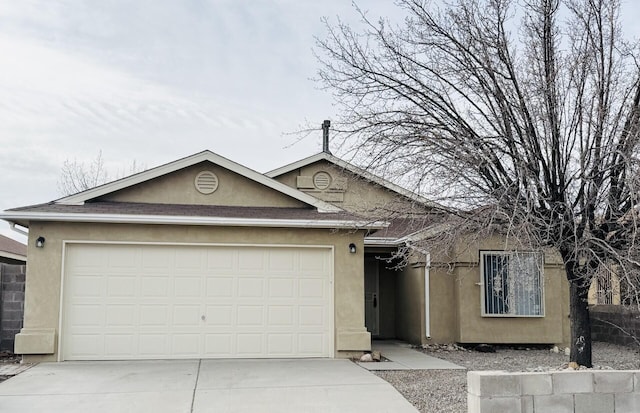 ranch-style home with a garage