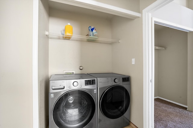 laundry room featuring washer and dryer and carpet flooring