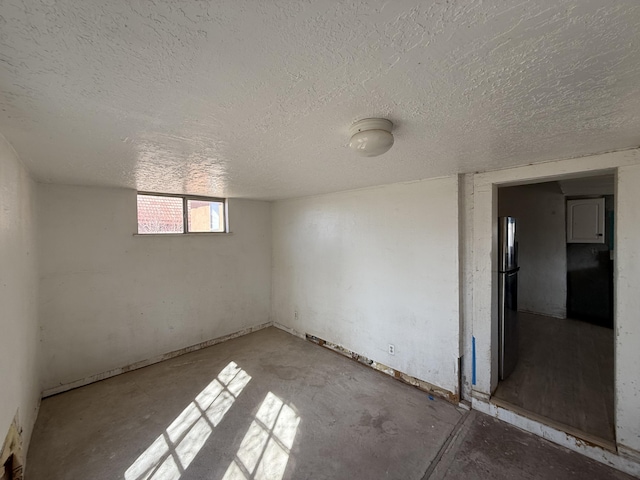 empty room featuring a textured ceiling