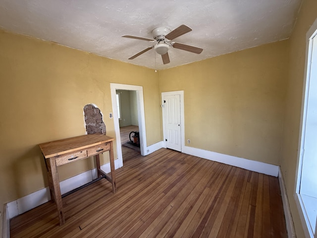 interior space featuring ceiling fan and wood-type flooring