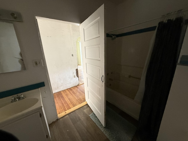 bathroom featuring vanity, hardwood / wood-style floors, and shower / bathing tub combination