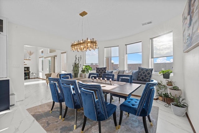 dining space with an inviting chandelier