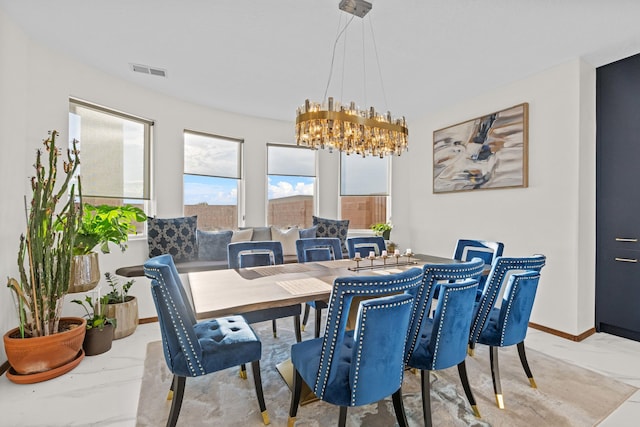 dining room featuring a chandelier