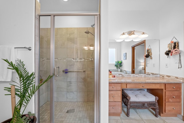 bathroom with vanity, tile patterned floors, and walk in shower