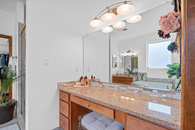 bathroom featuring independent shower and bath and vanity