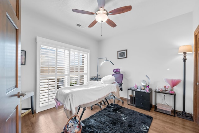 bedroom featuring ceiling fan and hardwood / wood-style floors