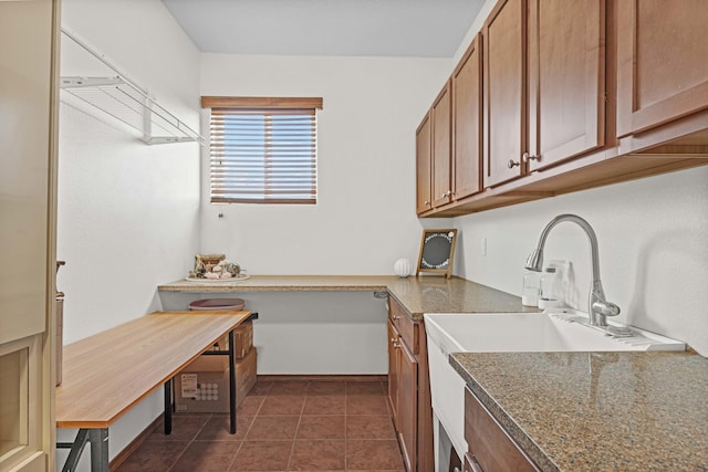 kitchen featuring dark tile patterned flooring